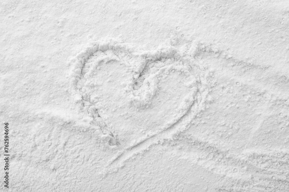 Heart drawn on baking powder, top view Heart drawn on baking powder, top view