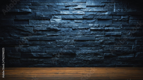 Background and texture of black and blue stone brick and wooden floor with light illuminated in places. 