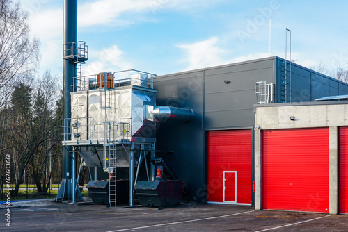 New modern wood chip biofuel boiler house for increased heat energy production efficiency in action photo
