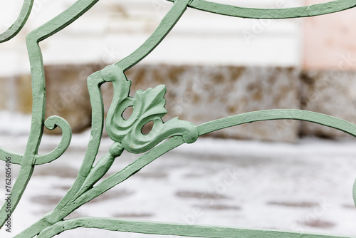 Vintage green forged railings details, close-up photo