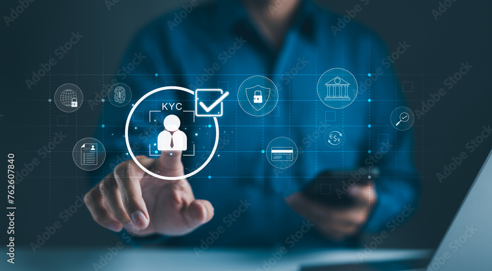 © Supatman - Interactive KYC compliance interface with the user. Business professional interacting with a Know Your Customer (KYC) compliance and security interface on digital screen. Identity verification, E KYC,