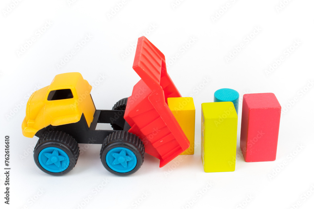 Top view of colorful wooden bricks on the table. Early learning. Educational toys on a white background. Top view of colorful wooden bricks on the table. Early learning. Educational toys on a white background.