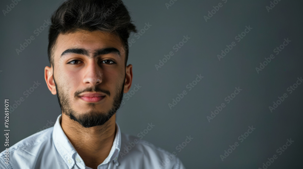 young Muslim man on the gray