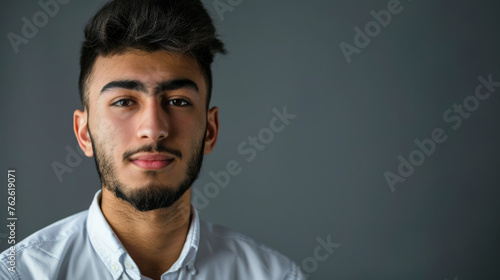young Muslim man on the gray