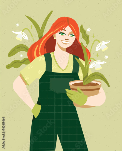 Woman gardening in overalls holding daffodil flowers. 