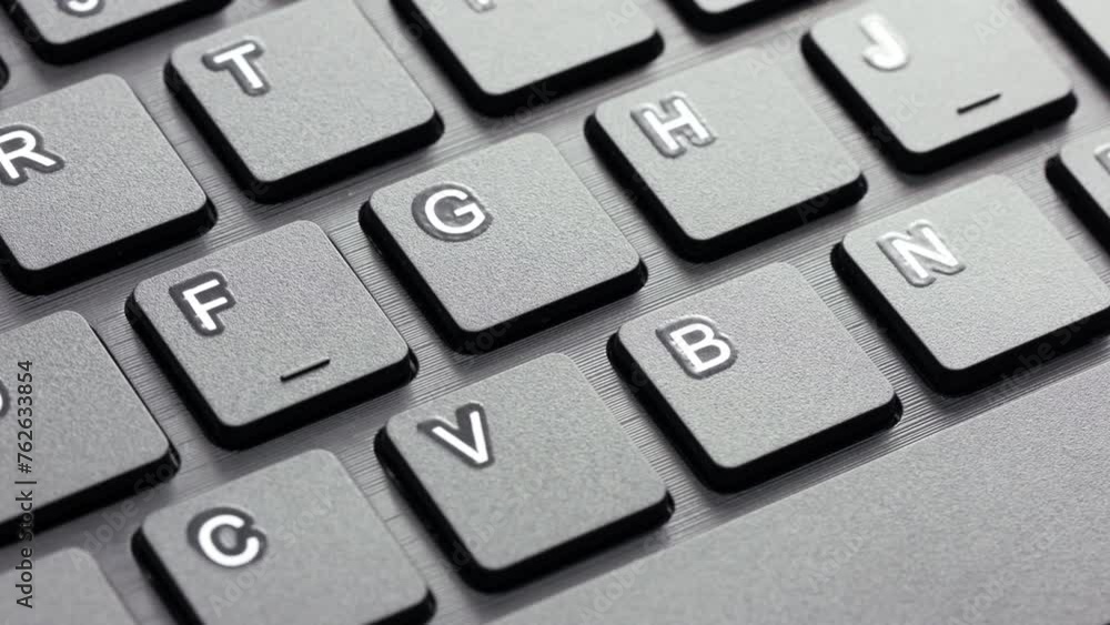 Close up computer keyboard slowly rotating Close up computer keyboard slowly rotating