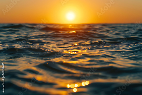 The Sun Setting Over the Ocean Water © Maksym