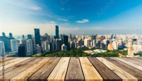 the empty wooden table top with blur background of city skyline exuberant image
