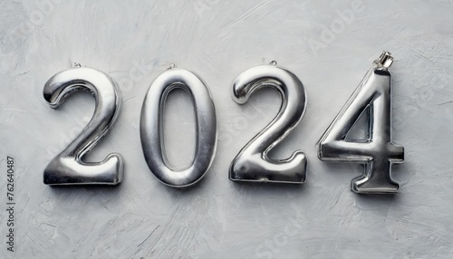the numeral of the year 2024 is silver on a light white background