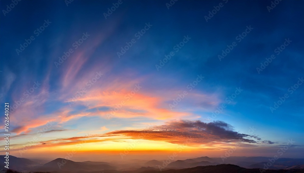 ultra wide panorama of the sunset sky light separated colored clouds there are no birds in the sky