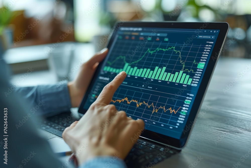 Financial Expert Analyzing Stock Market Trends on Laptop Financial Expert Analyzing Stock Market Trends on Laptop