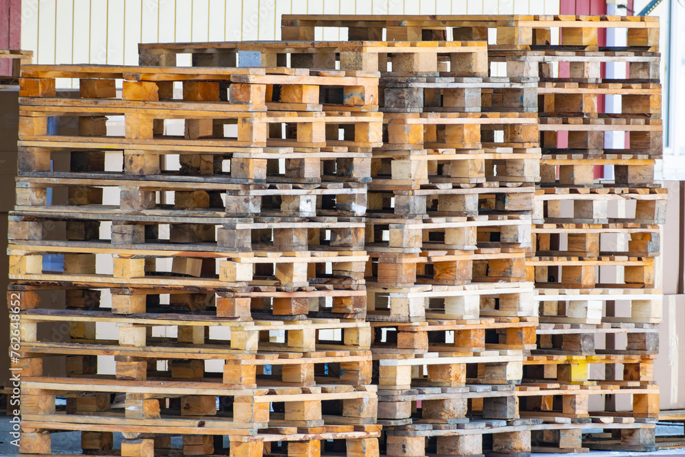 stack of empty wooden pallets for shipping goods stack of empty wooden pallets for shipping goods
