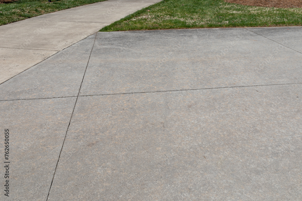 Obraz premium Two concrete paths converging, one wide and one narrow, creative copy space, horizontal aspect