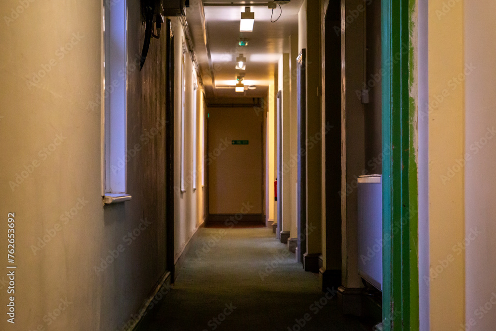 Corridor of a early 1900's building with modern updates to keep the building compliant and able to continue to be used