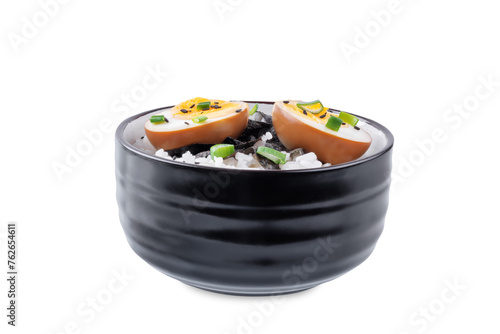 Tamago soy sauce eggs with rice and nori on a white isolated background