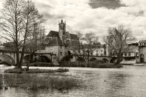 Scenic view of Moret-sur-Loing medieval and impressionist town in Ile-de-France listed among the Most Beautiful Detours of France, one hour from Paris. French travel background. Sepia historic photo © Elena Dijour