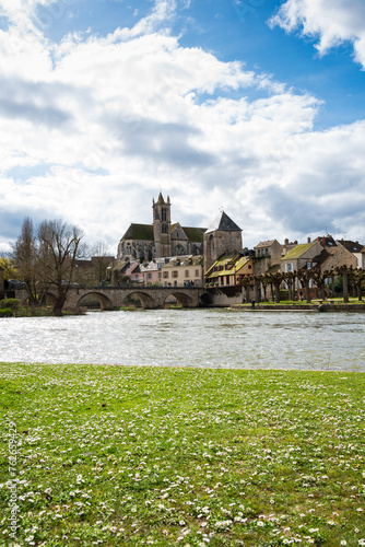Scenic view of Moret-sur-Loing in spring. This medieval and impressionist town in Ile-de-France is listed among the Most Beautiful Detours of France, only one hour from Paris. French travel background © Elena Dijour