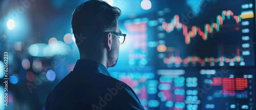 Stock trading investor, trader or broker analyst working analysing exchange market using computer investing money in financial market analyzing charts data looking at computer screen. photo