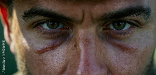 Close-up face and eyes, a soldier at war or in action, combat st photo