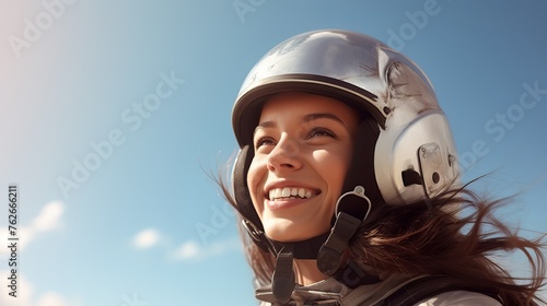 Parachuting young woman smiles © Ruslan