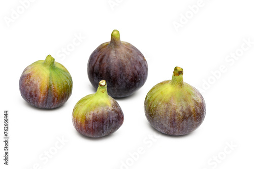 Isolated figs. One and a half fresh fig fruits isolated on white background
