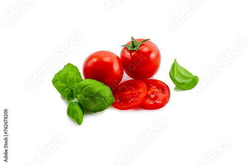 Ripe red tomato and basil on a white background isolate	