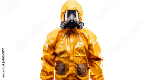 A man in a yellow protective suit and gas mask stands guard in a hazardous environment