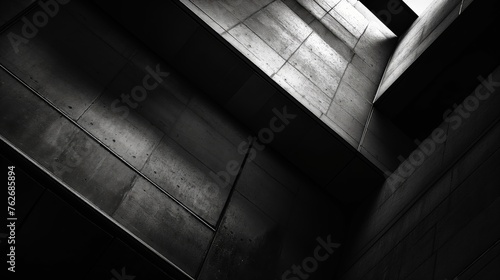 Monochrome image showcasing a dynamic contrast of light and shadows in a modern concrete structure