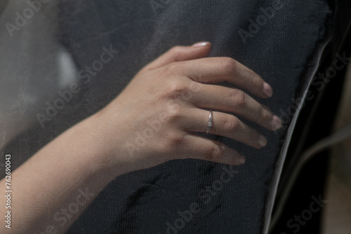 a man holding a girl's hand with a wedding ring