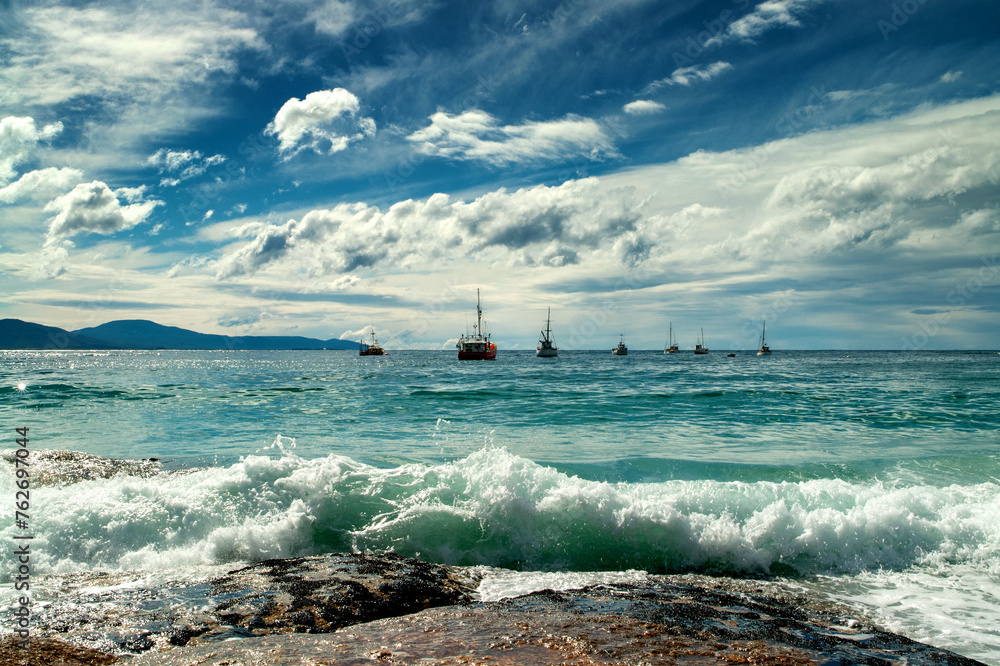 coastal scenery with fishing boats, Tasmania, Australia