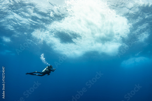 Scuba diver in open water, French Polynesia