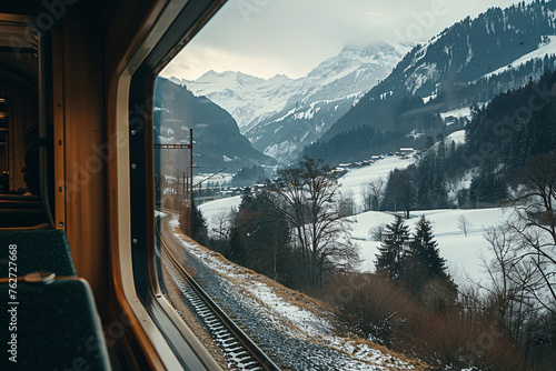 A scenic train journey through the Swiss Alps with snow © Daniel