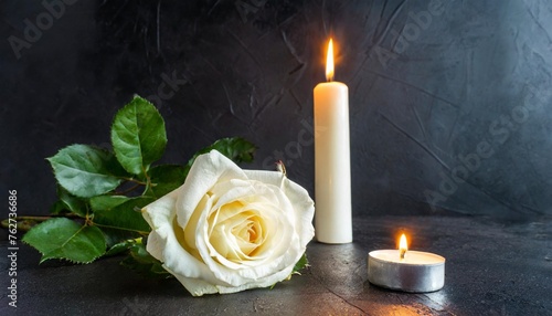 condolence grieving card loss funerals support elegant white rose with burning candle on a black texture background for sending words of support and comfort photo