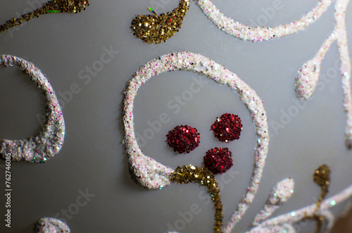 Pattern of multi-colored sparkles on a white background, close-up