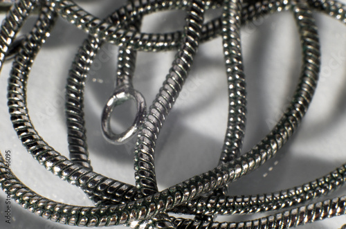 Silver chain close-up on white background