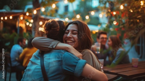 beautiful women giving each other a greeting hug in a restaurant or cafe during the day and very happy in high resolution and high quality. concept friends  biodiversity  multicultural  friendship