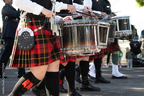 Irish drum line wearing kilts and spats in honor of the Irish tradition during the St Patricks Day parade © motionshooter