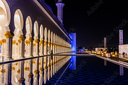 Night view of the colonnade of Sheikh Zayed Grand Mosque in Abu Dhabi, United Arab Emirates.