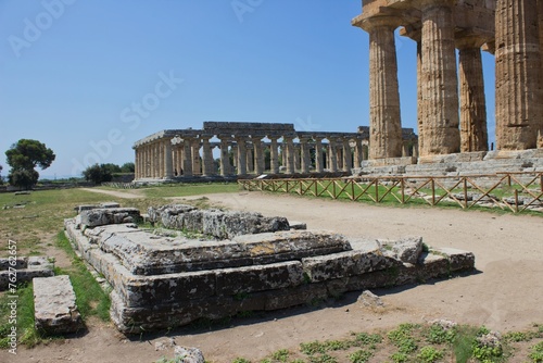 The beautiful archaeological park of Paestum in the province of Salerno, in Campania, Italy. The park includes the remains of the ancient Greek city of Poseidonia, founded in the 6th century BC . photo