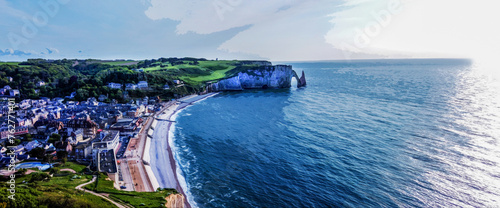 Fotografie Drone view on Etretat village in Normandy and beach and water of Manche (English