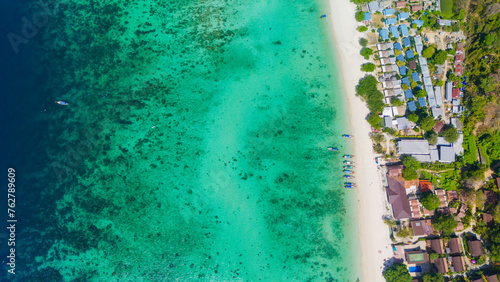 Long beach at Koh Phi Phi island, Krabi, Thailand. Tropical paradise white sand beach with turquoise waters of Andaman sea, aerial view. © Alisa