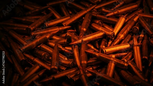 Pile Of Bullets In Firelight Closeup photo