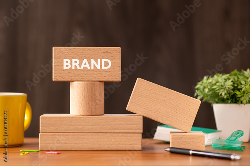 There is wood block with the word BRAND. It is as an eye-catching image.