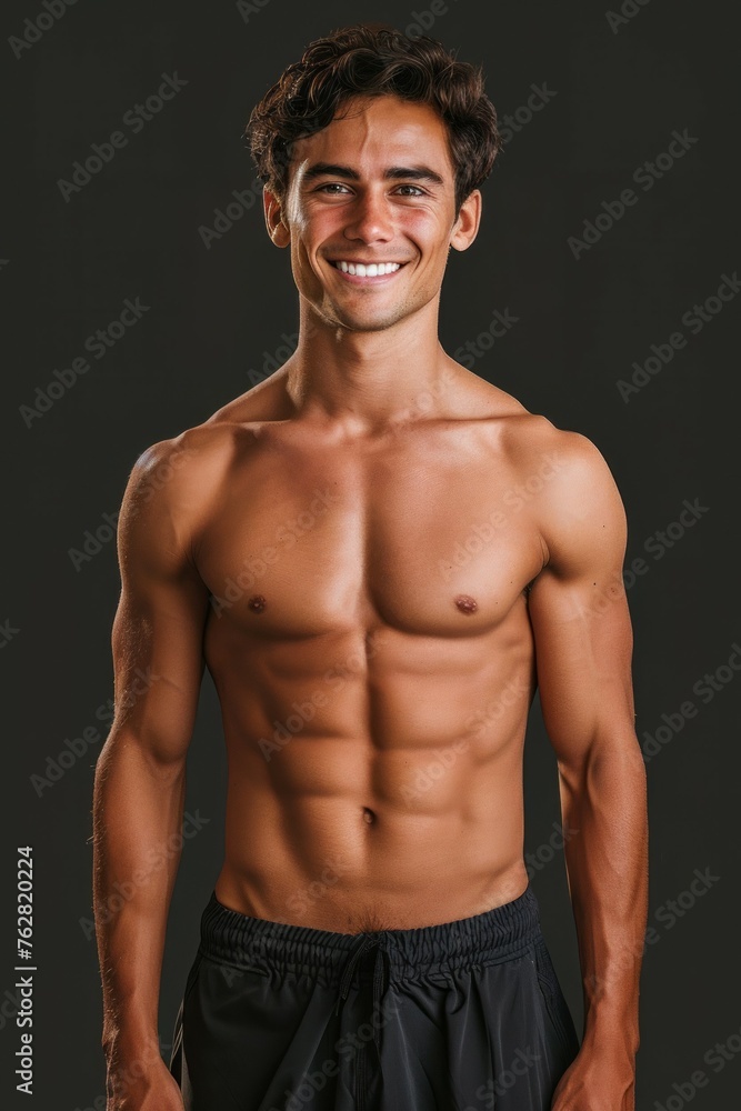 Brutal man with pumped up muscles, vertical portrait. Backdrop with selective focus and copy space Brutal man with pumped up muscles, vertical portrait. Backdrop with selective focus and copy space