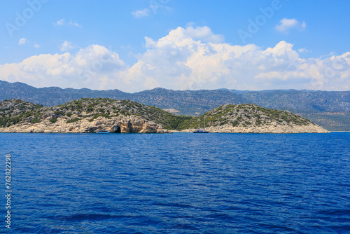 View of the rocky shore from the sea. Mediterranean Sea in Turkey. Popular tourist places. Background © Iurii Gagarin