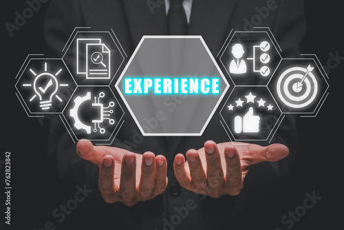 Experience concept, Businessman hands holding experience icon on virtual sceen.