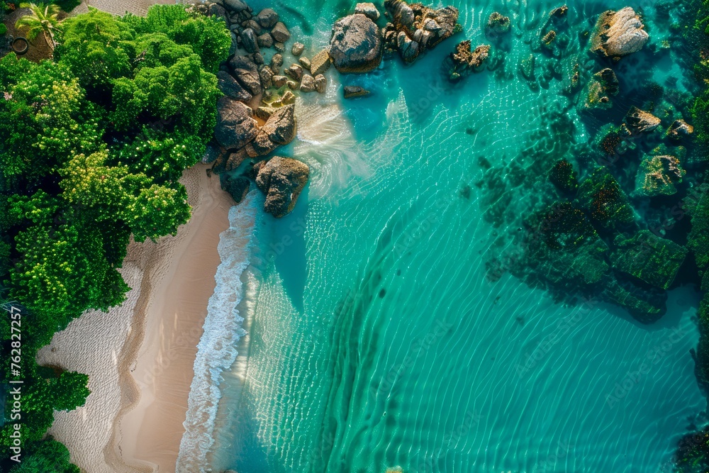 Aerial View of a Pristine Tropical Beach with Turquoise Water, Lush Greenery, and Rocky Coastline