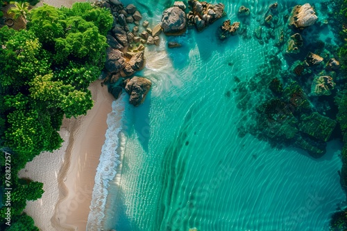 Aerial View of a Pristine Tropical Beach with Turquoise Water, Lush Greenery, and Rocky Coastline