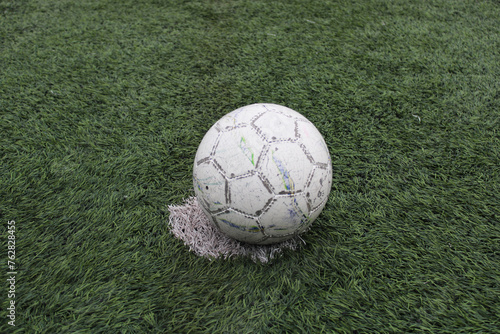  white soccer ball on the grass. soccer field and white line.