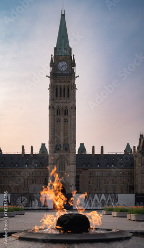 Fotografie Centennial Flame monument on Parliament Hill commemorating the 100th anniversary of the Canadian Confederation, with the Peace Tower at dusk, Ottawa, Ontario, Canada